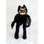 An early 20th Century straw stuffed, wire framed Felix the Cat