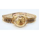 A 18ct. gold Rolex lady's Oyster Perpetual Datejust wristwatch on original gold bracelet - No.8570F