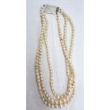 A triple string pearl necklace, with engraved sterling silver clasp