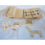 An Oriental carved bone gymnast, cased tile game with booklets and opium den group