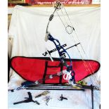 A Hoyt XT 2000 compound bow with stand, case and weight - sold with a quantity of carbon arrows