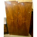 A 3' 11" Art Deco geometric walnut veneered double wardrobe with stepped top, fitted interior and
