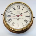 A brass cased bulkhead clock with dial marked H. S. T. M. I. & P. Co. Ltd - Riva Selby - Hull