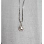 A diamond encrusted pendant, on an 18ct. white gold box-link chain