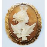 A 2¼" unmarked 9ct. gold oval framed cameo brooch