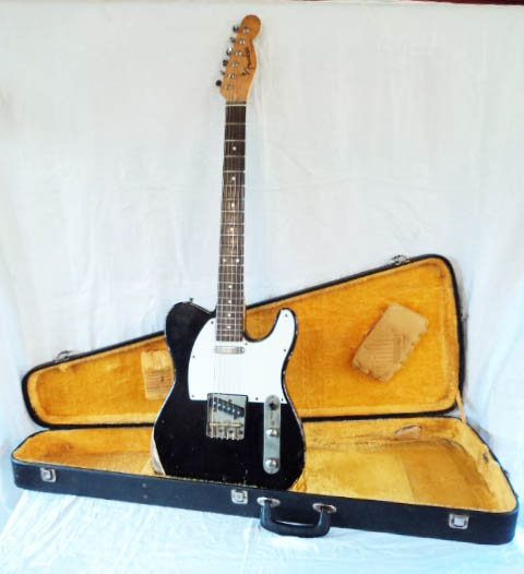 A 1980's Fender Telecaster style electric guitar in road worn black finish, with hard case