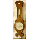 A walnut cased aneroid barometer/thermometer, with C-scroll decoration and 1930 patent S & M Tycos