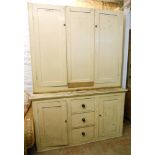 A 5' 9" Victorian painted pine housemaid's cupboard, with shelves enclosed by a pair of panelled