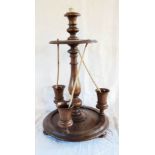 A turned wood table top drinks stand with central candle stick - sold with three clay pipes