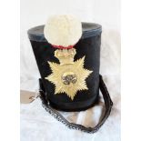 An antique shako bearing a South Devon Regiment of Militia badge and white ball tuft - missing