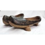 A pair of old wooden clogs with incised decoration