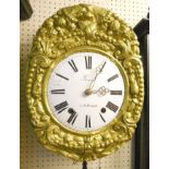 A 19th Century French Comtoise wall clock, with ornate pressed gilded tin border and white enamelled