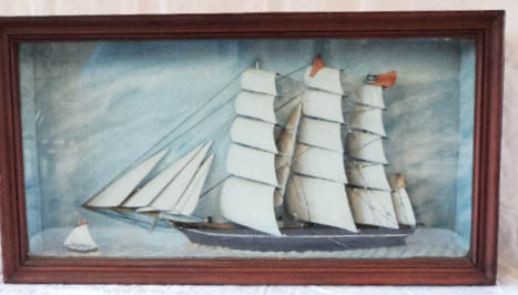 A 33" old half hull model of a fully rigged sailing vessel mounted in a glaze front display case