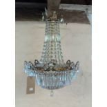 A pendant light fitting with gilt metal decoration and cut and faceted crystal drops