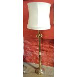 A brass column pattern standard lamp and shade