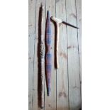 An ethnic bow with painted decoration - sold with a Polynesian digging stick and a tribal spear with