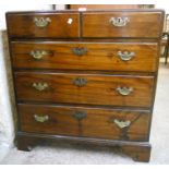 A 33" 19th Century mahogany chest of two short and three long graduated oak lined drawers, set on