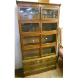 A 34 3/4" early 20th Century Globe-Wernicke style inlaid oak bookcase with four pairs of glazed