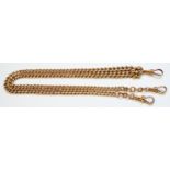 An 18ct. gold double Albert chain with three lobster clips - 69.9 grms.