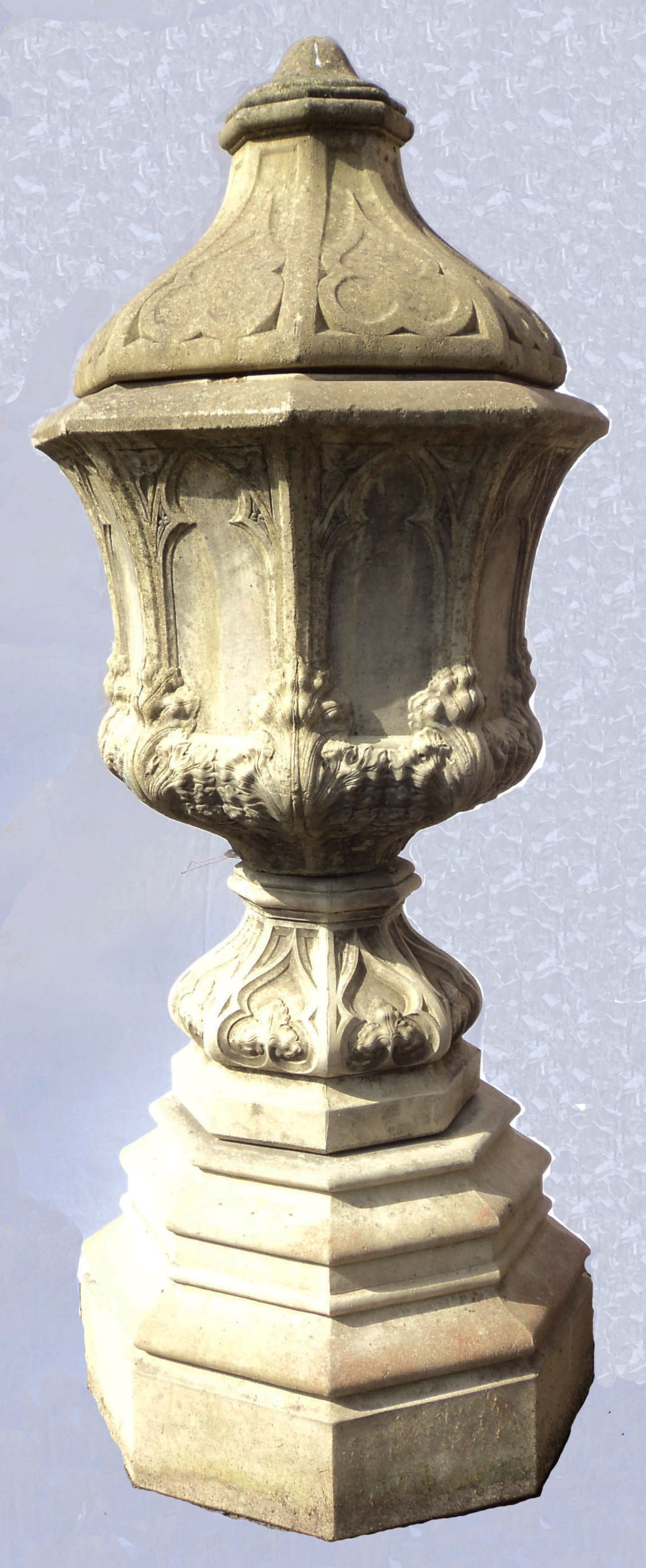 A 5' 9" four piece cast concrete Gothic style lidded pedestal urn or font of faceted design and arch