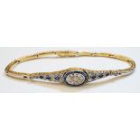 An 18ct. gold Art Deco design bracelet, the central panel set with multiple diamonds within a