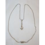 An unmarked early 20th Century old cut diamond set pendant necklace, with square setting and diamond