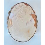 A 2 1/2" unmarked 9ct. gold framed oval cameo brooch