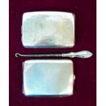 Two silver cigarette cases - London 1922 and Birmingham 1919 - sold with a silver handled button