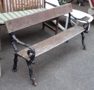 A 4' 2" Coalbrookdale style bench with branch pattern cast iron ends