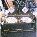 A 3' 6" painted wrought iron bench with scroll decoration and ceramic backs and seats - a/f