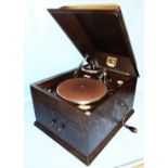 A vintage HMV polished oak cased wind-up gramophone, with HMV No.4 sound head and doors to front -