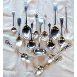 A small collection of silver and marked sterling cutlery items, including a pair of fiddle pattern