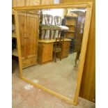 A moulded ash framed wall mirror with bevelled plate - 4' 3" x 4' 11" - matching Lot 259