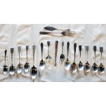 A small collection of silver cutlery, including fiddle pattern and other teaspoons, bright cut sugar