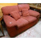 A 5' modern two seater settee with russet coloured upholstery - manufactured 14 March 2011