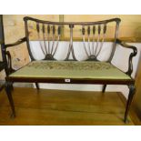 A 3' 7" Edwardian mahogany framed two seater settee with double tulip carved splat back and