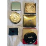 A collection of five gilt metal compacts including Regent of London, KG, etc. - sold with a
