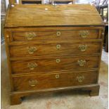 A 3' 1" Georgian mahogany bureau with pigeonhole and drawer fitted interior, four long graduated