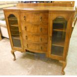 A 3' 6" 1930's figured walnut veneered break bow front sideboard, with four central drawers and