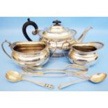 A silver three piece tea set of bulbous design with gadrooned rims - Sheffield 1914, 15 and 17 -