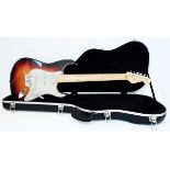 A 1994 Fender USA standard Stratocaster, in three colour sunburst with maple neck, made in Corona,