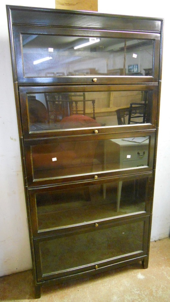 A 34" stained wood Globe-Wernicke style five sectioned bookcase by Gunn, bearing "Angus" logo, set