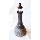 A 16" serpentine table lamp in the form of a lighthouse on a crag