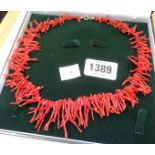 A cased red branch coral choker necklace