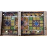 A multicoloured stained glass window panel 36" x 18 1/2" - sold with a box of spare glass