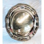 An 11" diameter silver salver, with shaped gadrooned rim and central dedication - Sheffield 1889 -