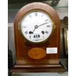 An Edwardian inlaid mahogany cased dome top mantel clock with flanking brass drop handles and PH & S