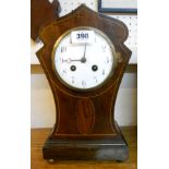 An Art Nouveau boxwood strung mahogany cased mantel clock, with French eight day gong striking