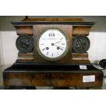A 19th Century walnut and ebonised cased mantel clock, with flanking cameo bust panels and French