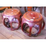 A pair of 12" diameter Chinese hardwood circular low side tables with pierced bulbous bodies